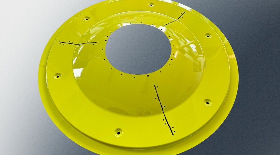 The yellow cover is a specially manufactured component for the mower of agricultural machinery, produced in small series at weba Deutschland. This robust metal part stands out for its high precision and durability, optimized for demanding agricultural conditions. The precisely placed drill holes and markings ensure easy and secure installation.